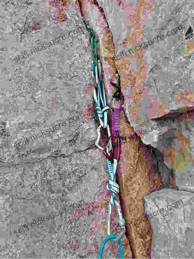 A Climber Ascending A Single Pitch Rock Face, Using Fixed Anchors For Protection. Climbing: From Single Pitch To Multipitch (How To Climb)